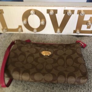 Like new worn once Pink Coach Wristlet